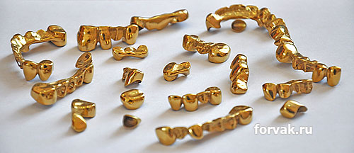 Напыление металлических зубных протезов под золото